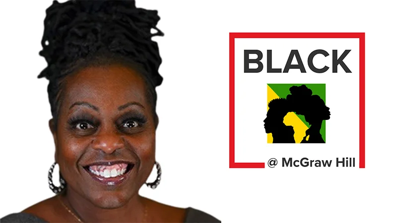 Leslie smiling with the BLACK at McGraw Hill logo behind her