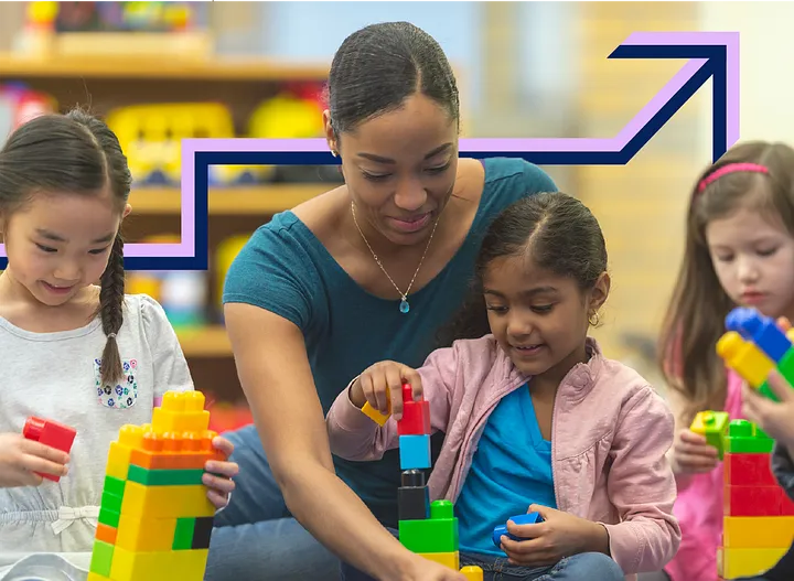 A teacher engaging with young children in a classroom setting
