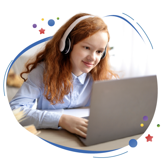 Personalized, Independent Reading:  A child wearing headphones smiles as she uses her laptop.